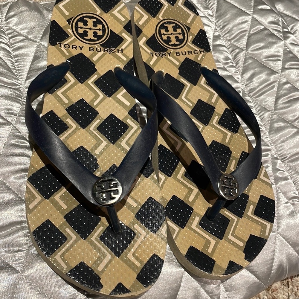 Tory Burch navy and tan printed flip flops